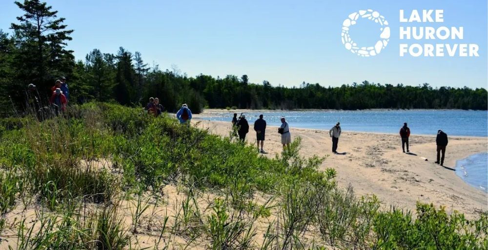 In 2022 at the One Water Gathering, Participants Explore the Shoreline of North Point.